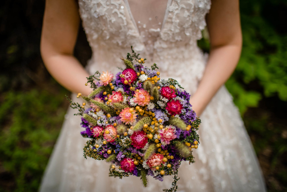 Detail of bride's bouquet made of dried wildflowers purchased from Michaels
