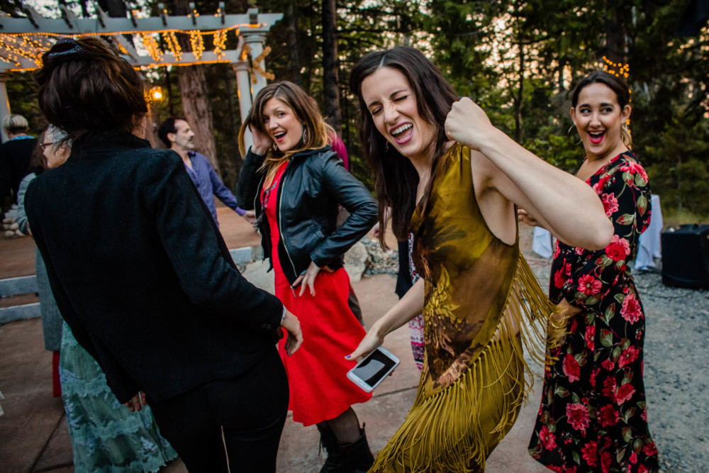 Guests dancing at a wedding reception in the mountains at Paradise Springs