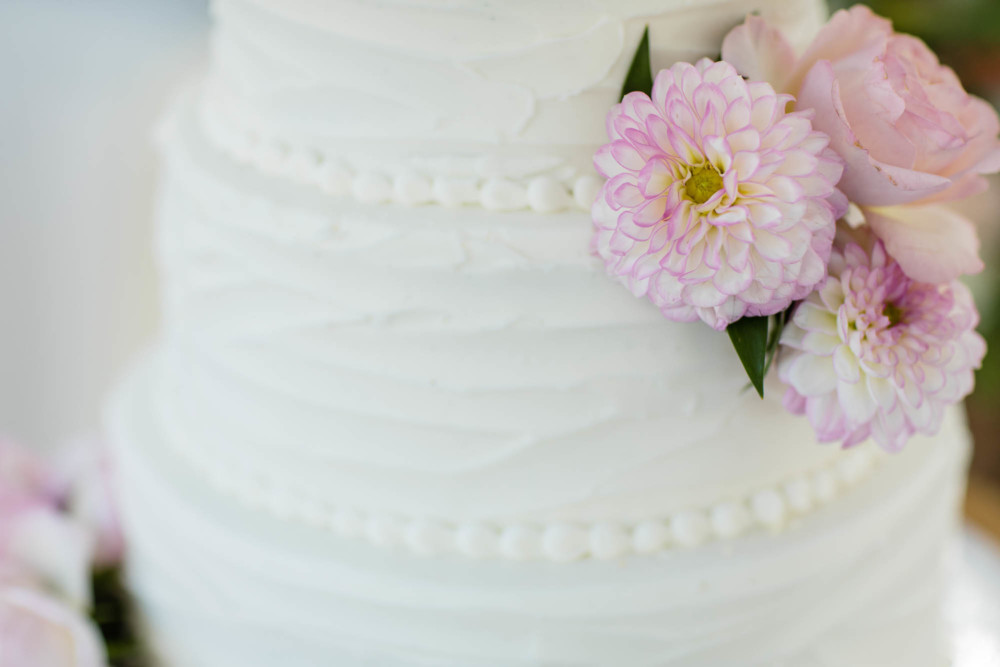 Detail of a wedding cake and floral display