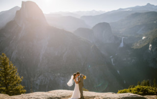 Wedding couple at sunrise at Glacier Point with Half Dome, Vernal Falls, and Nevada Falls Below